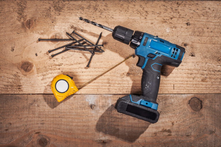 Set of work tools on wooden plank on construction site